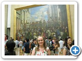 Jennifer poses in front of The Wedding at Cana at The Louvre.
